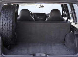 No head rests for the rear passengers. They can snap their necks at the cost of the bean counters.